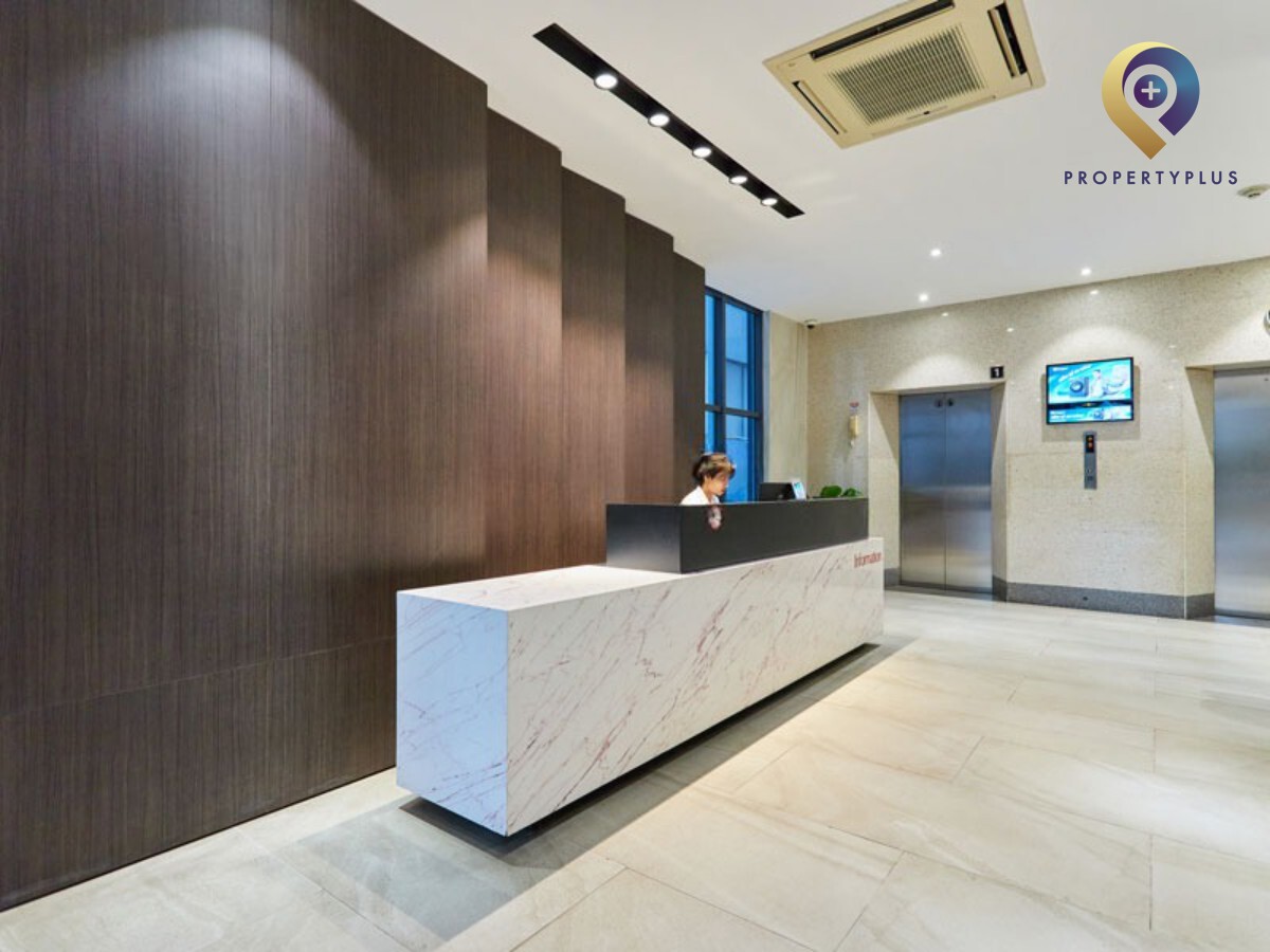 Reception lobby area with modern design and lighting at Toyota Building